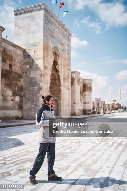 traveler standing near ancient building in city - konya stock pictures, royalty-free photos & images