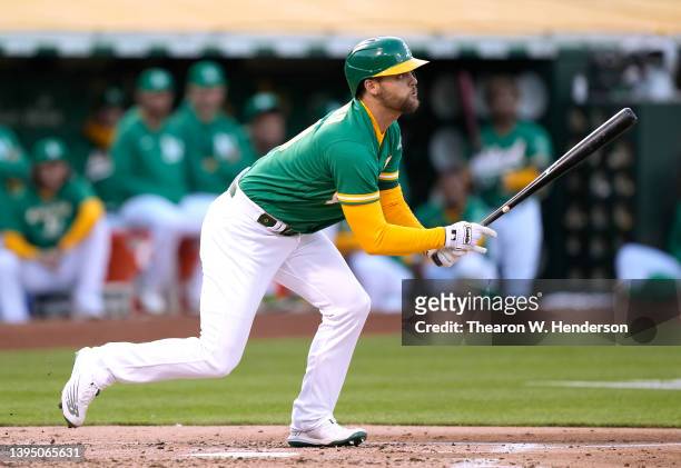 Chad Pinder of the Oakland Athletics hits an RBI single scoring Seth Brown against the Tampa Bay Rays in the bottom of the second inning at...