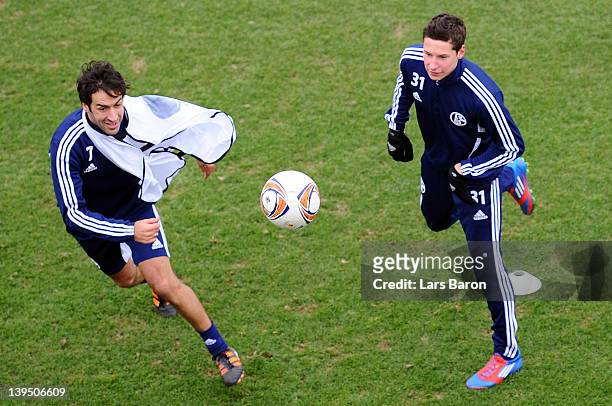 Raul Gonzalez challenges Julian Draxler during a FC Schalke 04 training session ahead of their UEFA Europa League round of 32 second leg match...
