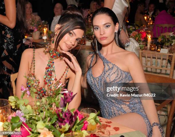 Emily Ratajkowski and Lily James attend The 2022 Met Gala Celebrating "In America: An Anthology of Fashion" at The Metropolitan Museum of Art on May...