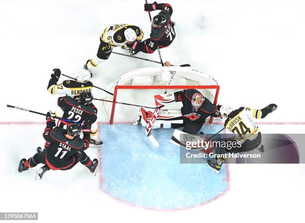 Antti Raanta of the Carolina Hurricanes stops a shot by Jake DeBrusk of the Boston Bruins during Game One of the First Round of the 2022 Stanley Cup...