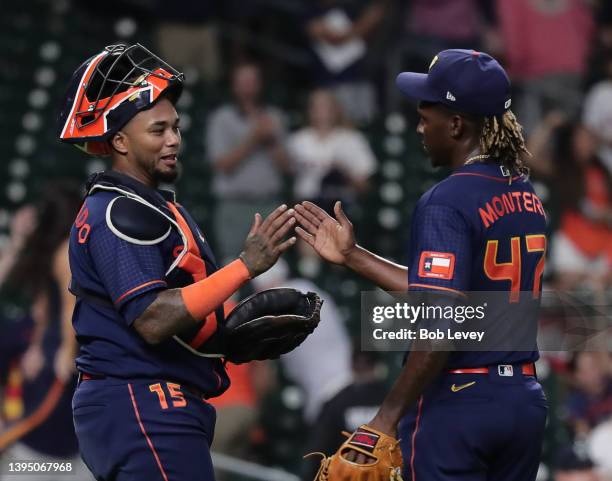 Pitcher Rafael Montero of the Houston Astros celebrates with Martin Maldonado after a 3-0 win over the Seattle Mariners at Minute Maid Park on May...