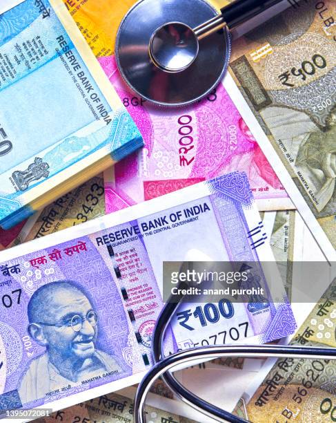 healthcare and medicine in india - indian money ストックフォトと画像