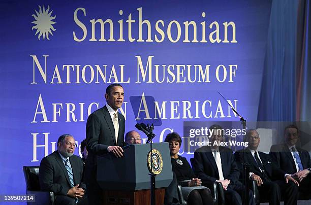 President Barack Obama speaks as museum director Lonnie Bunch, co-chair of National Museum of African American History and Culture council Richard...