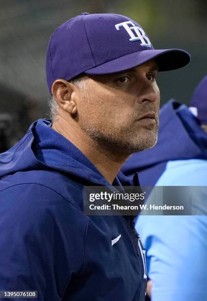 Manager Kevin Cash of the Tampa Bay Rays looks on from the dugout in the bottom of the eighth inning against the Oakland Athletics at RingCentral...