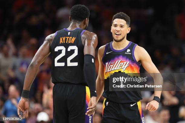 Devin Booker of the Phoenix Suns celebrates with Deandre Ayton during the first half of Game One of the Western Conference Second Round NBA Playoffs...