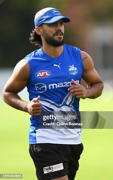 Aaron Hall of the Kangaroos runs laps during a North Melbourne Kangaroos AFL training session at Arden Street Ground on May 03, 2022 in Melbourne,...