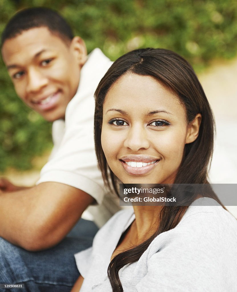 Young couple smiling in park