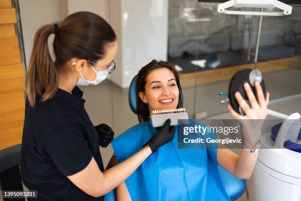 choosing a shade of dental veneers - enamel stock pictures, royalty-free photos & images