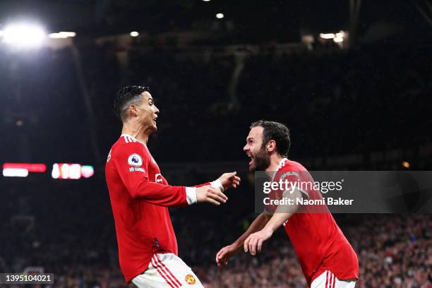 Cristiano Ronaldo of Manchester United celebrates his sides second goal with Juan Mata of Manchester United which is later disallowed by VAR during...