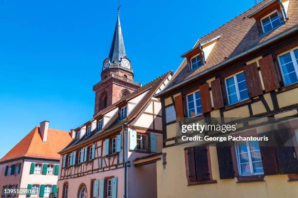 church tower in the french village of bergheim in alsace - alsace stock pictures, royalty-free photos & images