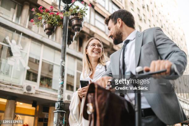 business people with electric scooter - couple scooter stock pictures, royalty-free photos & images