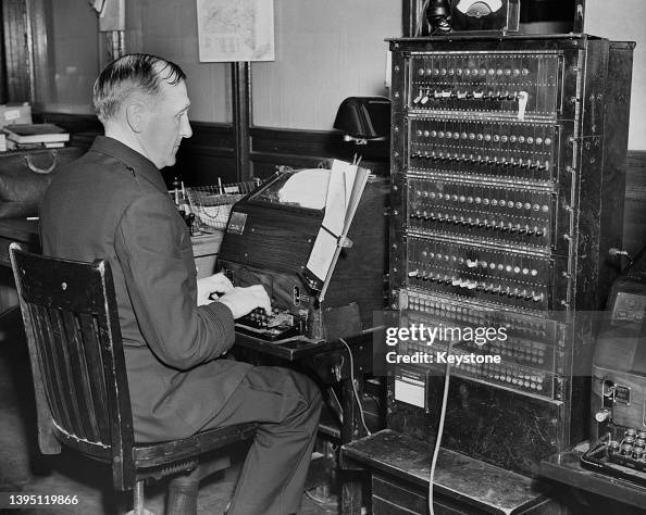 Teletype Machine Bells A teletype operator operating an teletype machine at New York police ...
