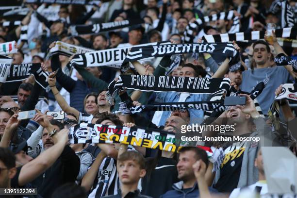 Juventus fans hold up scarves as the club's anthem is played prior to kic off in the Serie A match between Juventus and Venezia FC at Allianz Stadium...