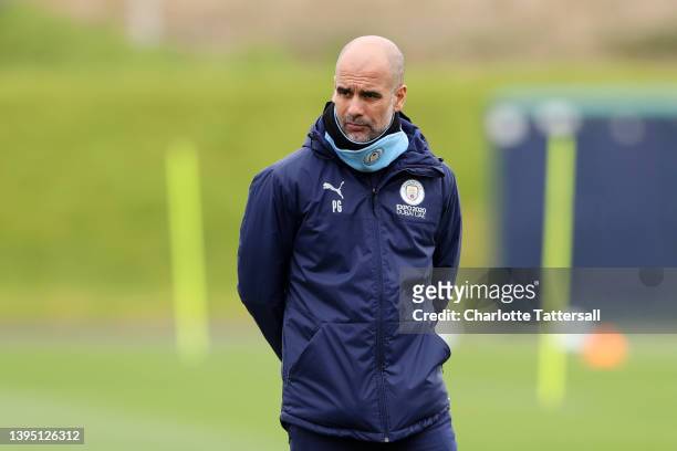 Pep Guardiola, Manager of Manchester City looks on during a training session at Manchester City Football Academy on May 03, 2022 in Manchester,...