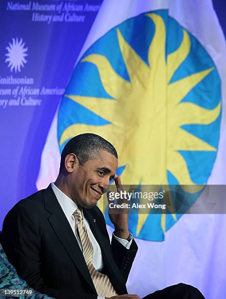 President Barack Obama listens during the groundbreaking ceremony of the National Museum of African American History and Culture February 22, 2012 in...