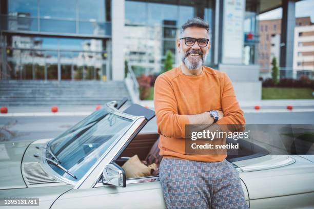 man standing next to his vintage car - hot rod car stock pictures, royalty-free photos & images