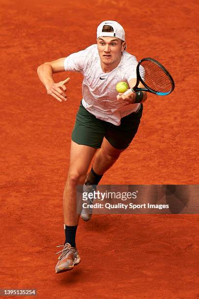 Jack Draper of Great Britain returns a ball to Andrey Rublev of Russia during their Men's Singles match on Day Six of the Mutua Madrid Open at La...
