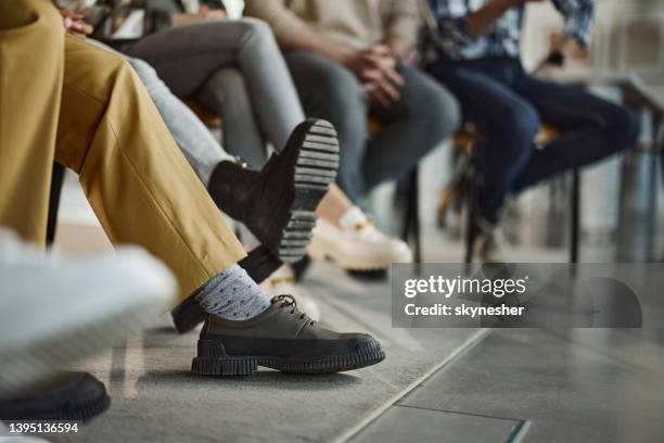 unrecognizable people in waiting room. - waiting room stock pictures, royalty-free photos & images