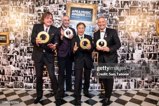 Murray Cook, Greg Page, Jeff Fatt, Anthony Field of the Wiggles pose for a photograph after winning the Ted Albert Award for Outstanding Services to...