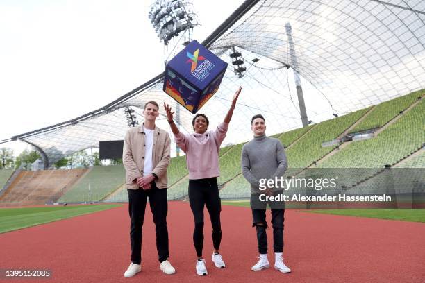 Olympic long jump champion Malaika Mihambo poses with para athlete Marc Lembeck and gymnast Marcel Nguyen the Olympiastadion prior to a press...