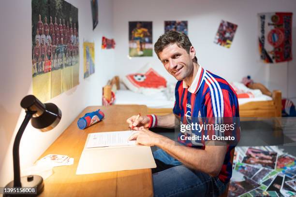 Thomas Müller of Bayern Muenchen signs his contract renewal until 2024 on May 03, 2022 in Munich, Germany.