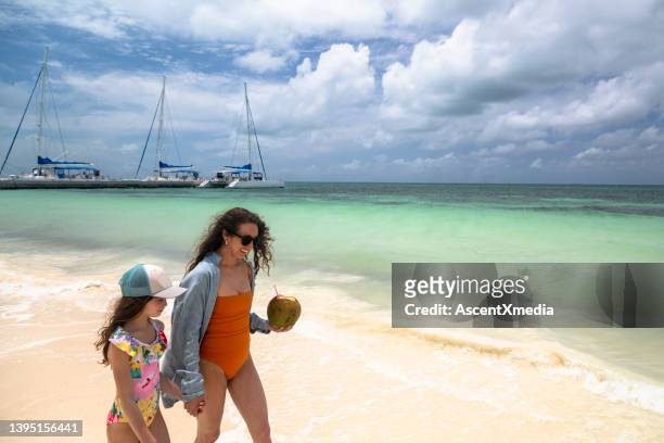 mother and daughter on a beach vacation - cuba beach stock pictures, royalty-free photos & images