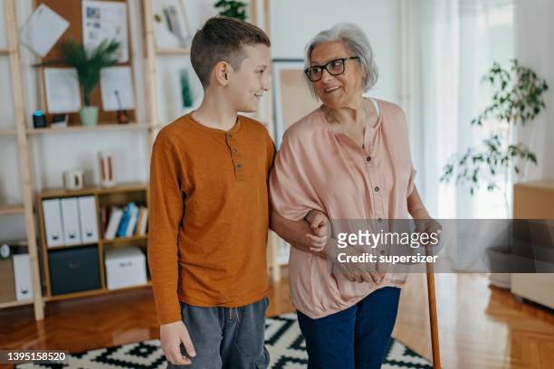grandma and grandson love - grandma cane stock pictures, royalty-free photos & images