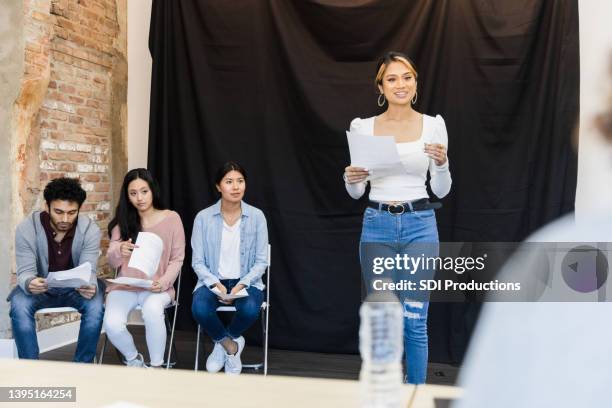 young woman auditions while others wait patiently - audition bildbanksfoton och bilder
