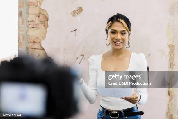 young woman uses digital camera to practice part for play - tv actress stock pictures, royalty-free photos & images