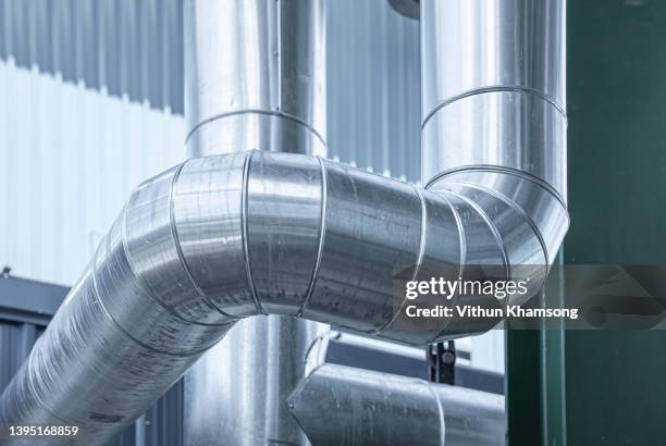 industrial zone, steel pipelines and equipment, pipelines and insulation - druckmesser stock-fotos und bilder