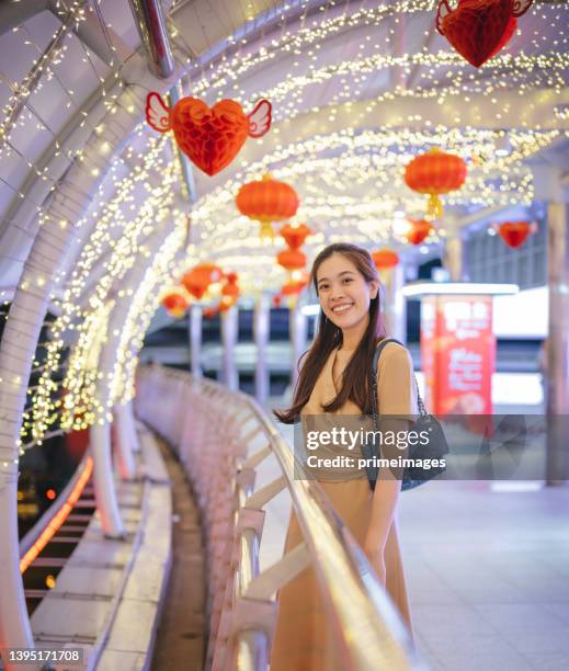 young relax asia office women on public transportation wainting train station bts chongnonsi at sathorn bangkok thailand - bts bangkok stock pictures, royalty-free photos & images