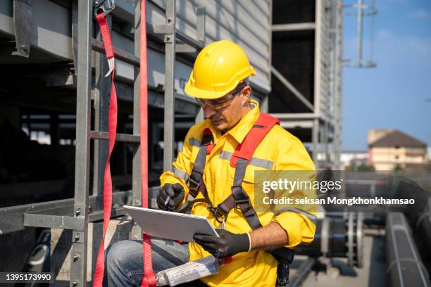engineer working at height with safety equipment. - metal pole stock pictures, royalty-free photos & images