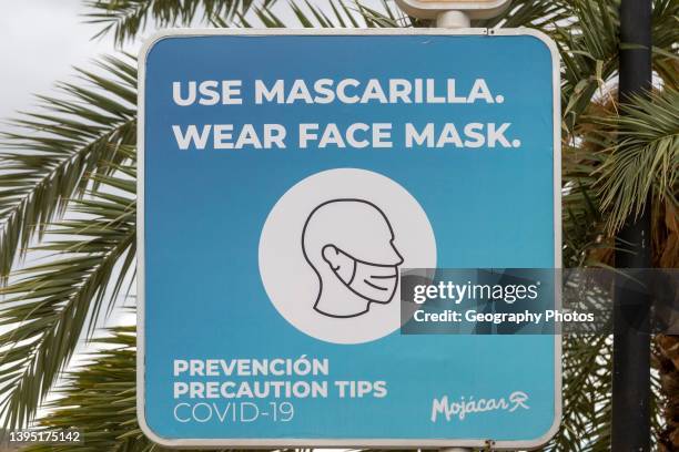 Wear a face mask to protect yourself from Covid-19 warning sign, Almeria, Mojacar, Spain.