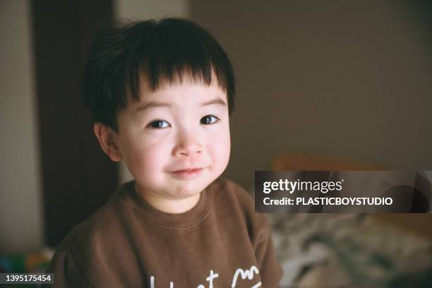 a child playing in the bedroom. - child portrait ストックフォトと画像