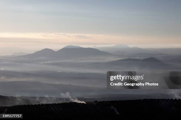 Misty morning view south over Rio Guadalquivir valley from Baeza, Jaen province, Andalusia, Spain.