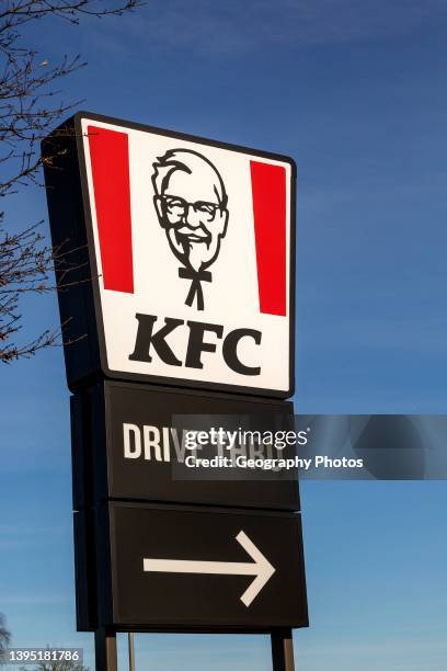 Banner sign Colonel Sanders advertising KFC Kentucky Fried Chicken Drive Thru outlet, Martlesham, Suffolk, England, UK.