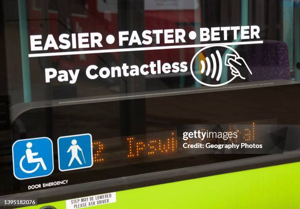 Pay Contactless sign on bus window, Ipswich, Suffolk, England, Uk.