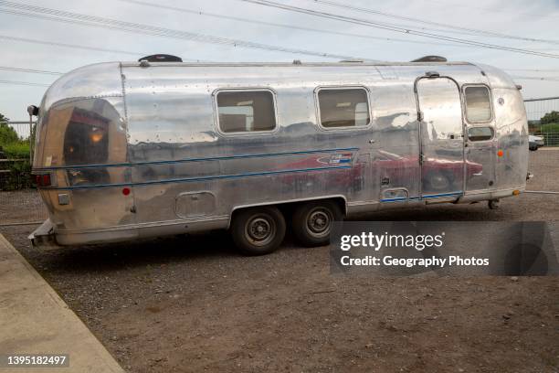 Vintage Airstream silver trailer caravan on display at an auction, Suffolk, England, UK.