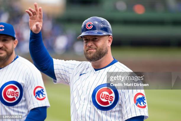Chicago Cubs first base coach Mike Napoli wears an Arsenal