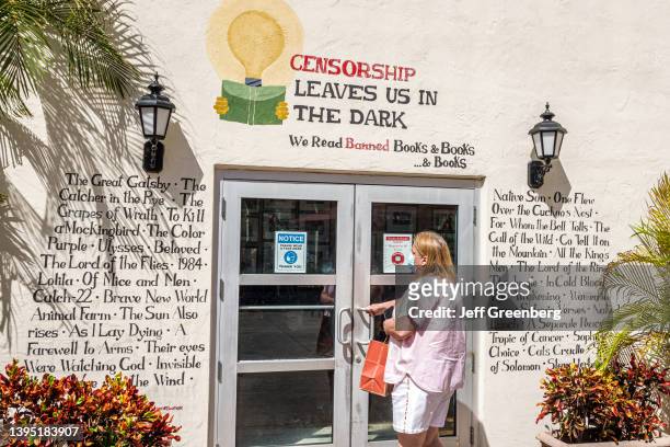 Coral Gables, Florida, Miami Books & Books bookstore, censorship banned books list on exterior wall.