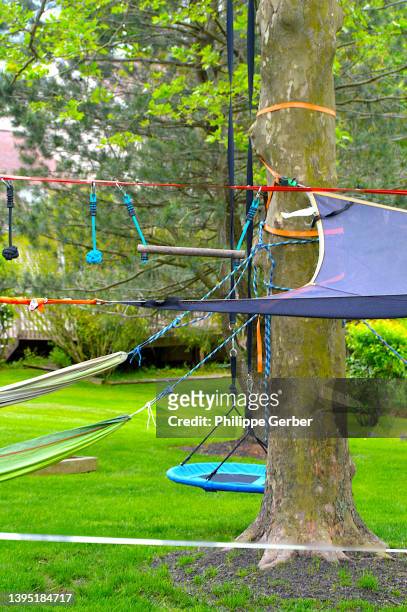 ninja obstacle course and hammocks in backyard - ninja obstacle course stock pictures, royalty-free photos & images