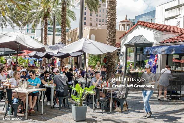 Coral Gables, Florida, pedestrian plaza and restaurant row, crowded outdoor dining area.