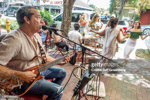 Little Havana, Miami, Florida, Cubata Tapas y Vinos Spanish tavern restaurant with live musician and women dancing.