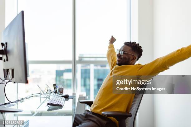 black ceo working in his modern office - bank office clerks stock pictures, royalty-free photos & images