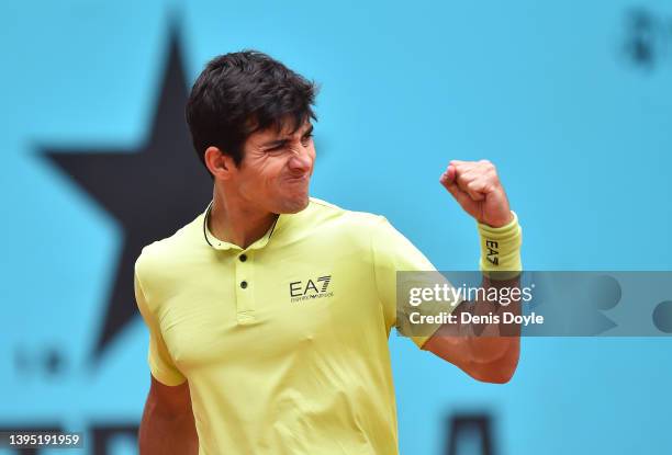 Cristian Garin of Chile celebrates in his first round match against Frances Tiafoe of the United States during day six of the Mutua Madrid Open at La...