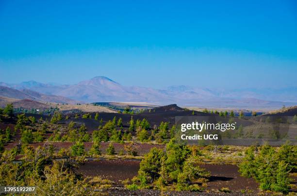 North America, USA, Idaho, Craters of the Moon National Monument and Preserve and Distant Pioneer Mountains.