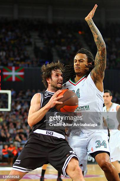 Raul Lopez, #31 of Gescrap BB competes with David Moss, #34 of Montepaschi Siena during 2011-2012 Turkish Airlines Euroleague TOP 16 Game Day 5...