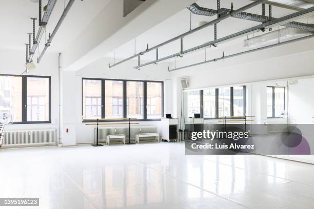 fitness studio interior with large mirrors and window - estudio de ballet fotografías e imágenes de stock