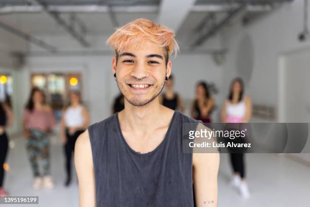 portrait of confident young asian man at dance class - incidental people asian stock pictures, royalty-free photos & images